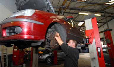 Mark fixing a car at Ainsdale Garage